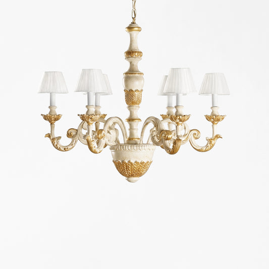 Traditional Italian wood chandelier with white and gold finish and white pleated shades.