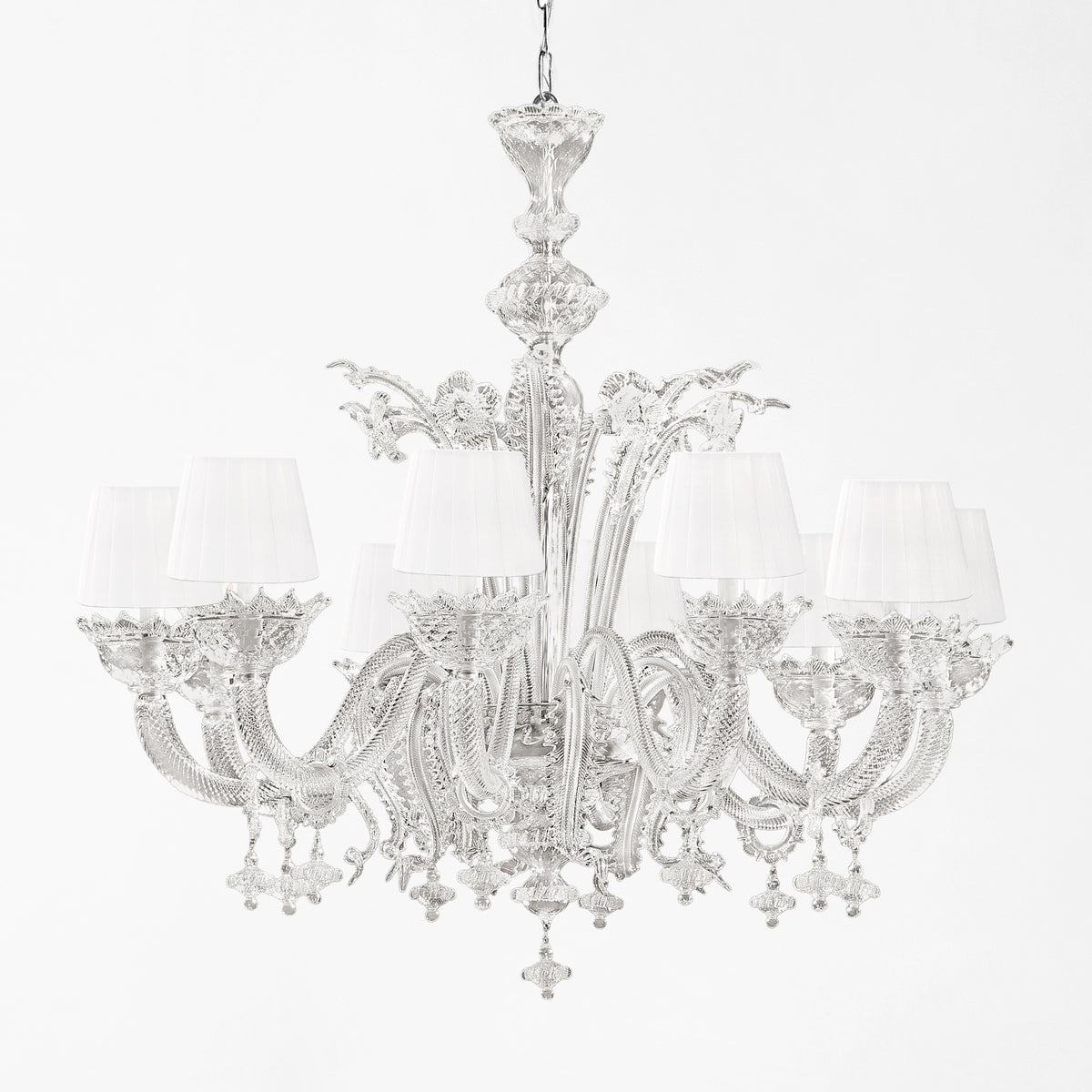 Ornate gray Murano glass chandelier with white shades.