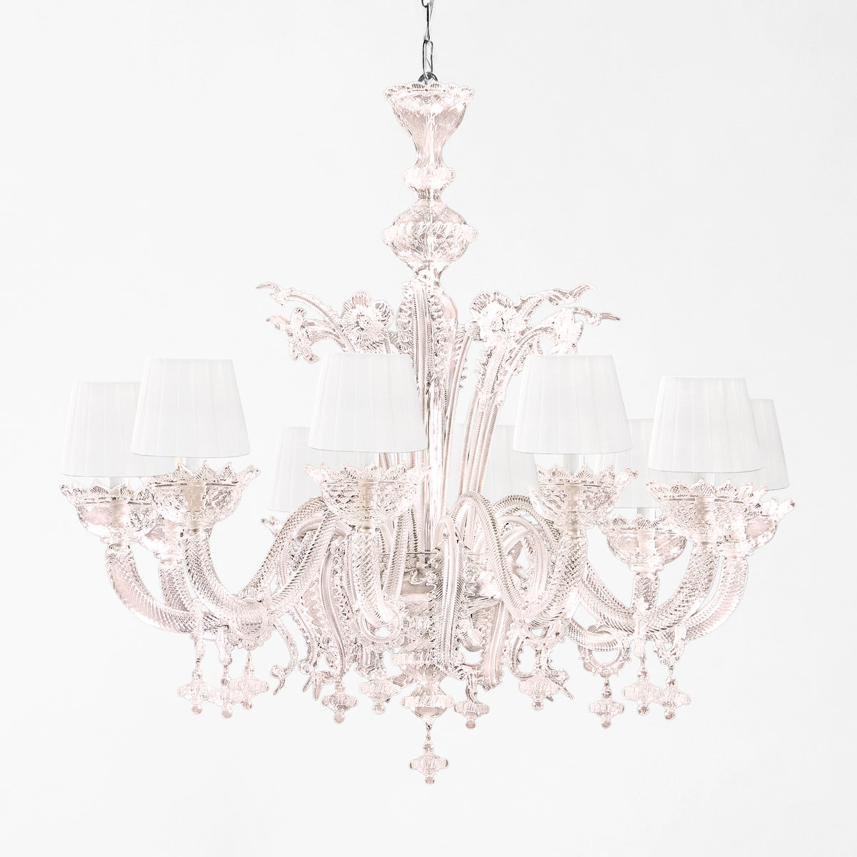 Pink Murano glass chandelier with white shades.