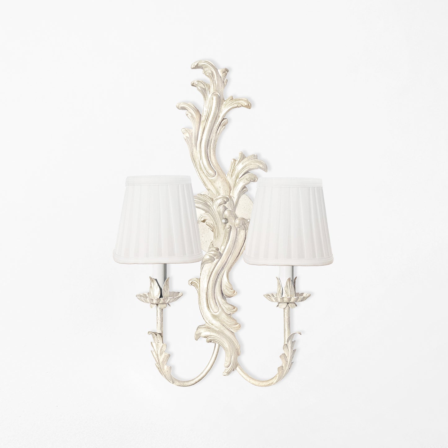 Antique white Italian white sconce with white pleated shades.