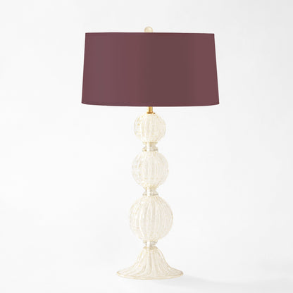 White Murano glass table lamp with burgundy lamp shade.