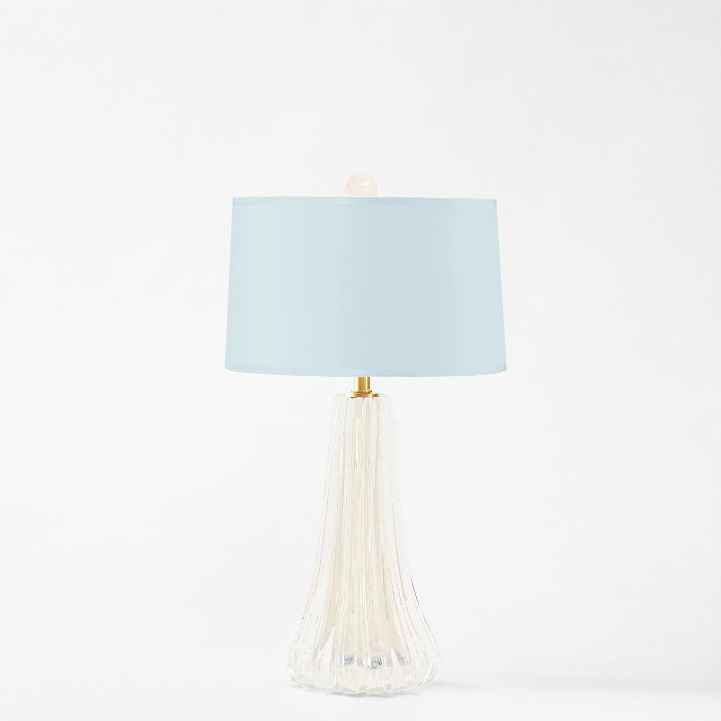 White Murano glass table lamp with light blue lamp shade.