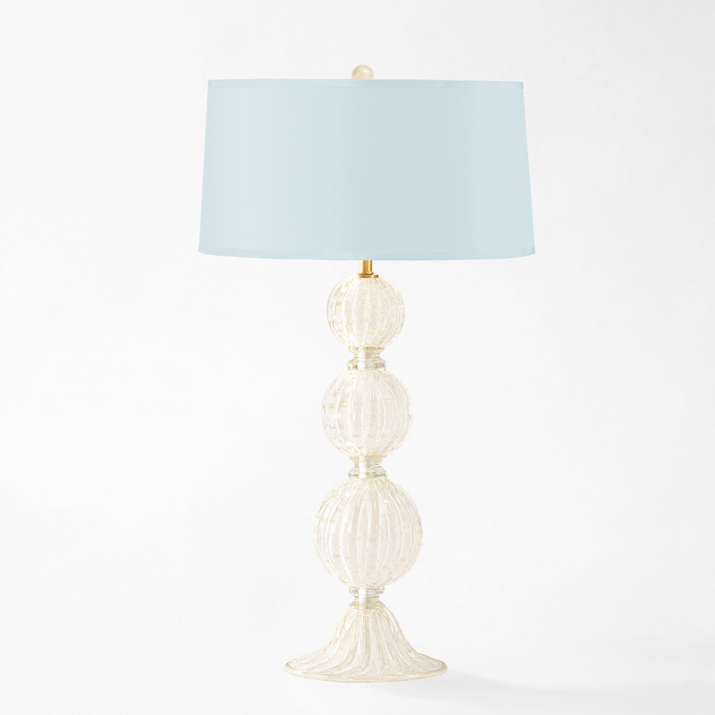 White Murano glass table lamp with light blue lamp shade.