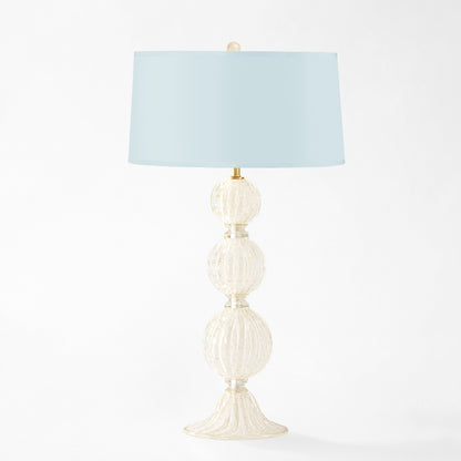 White Murano glass table lamp with light blue lamp shade.