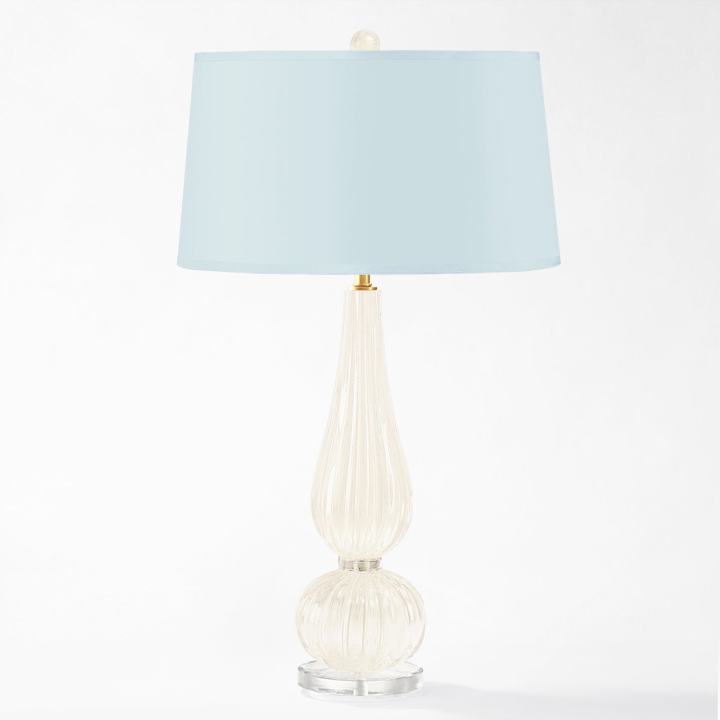 White Murano glass table lamp with light blue lamp shade.