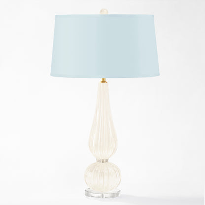 White Murano glass table lamp with light blue lamp shade.