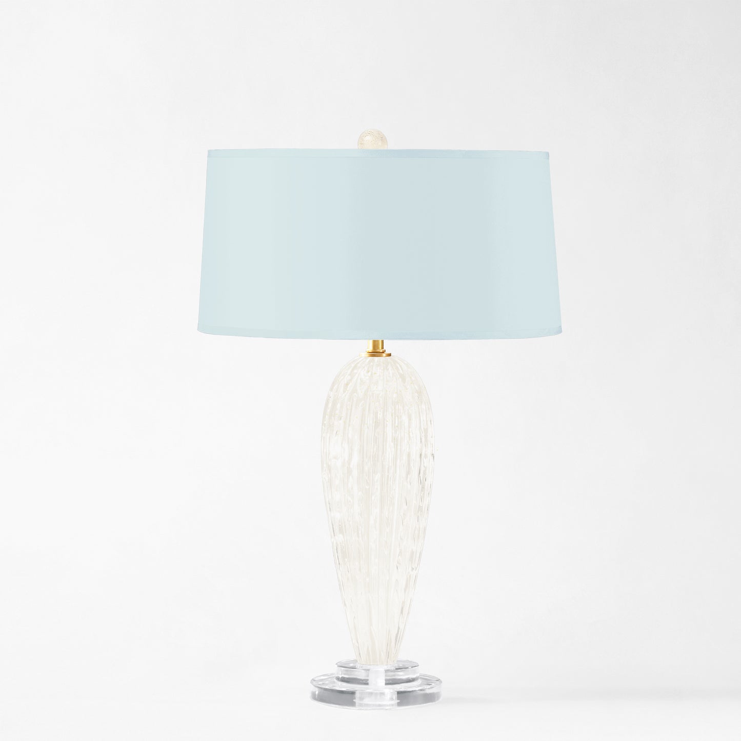 White Murano glass table lamp with light blue lamp shade.