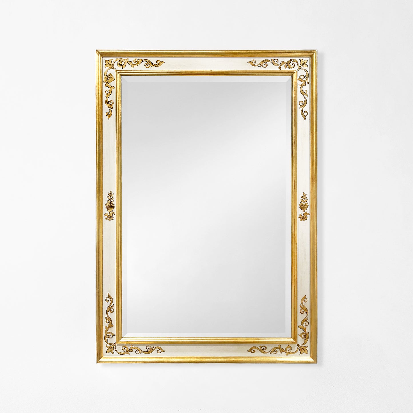 Traditional white Italian mirror with gold details.