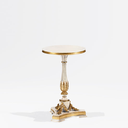 White accent table with gold leaf trim.
