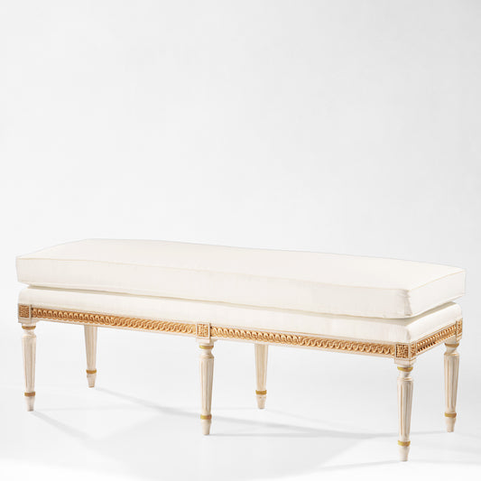 Antique white and gold bench with cream fabric.