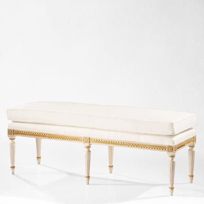 White and gold bench with white fabric.