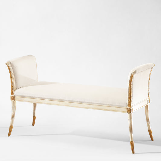White wood bench with antique gold trim.