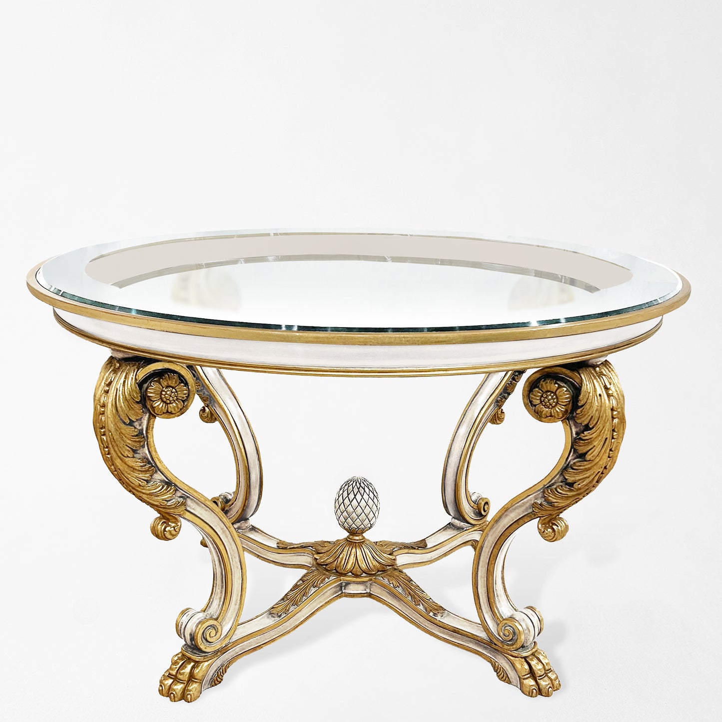 Decorative white center table with gold embellishments.