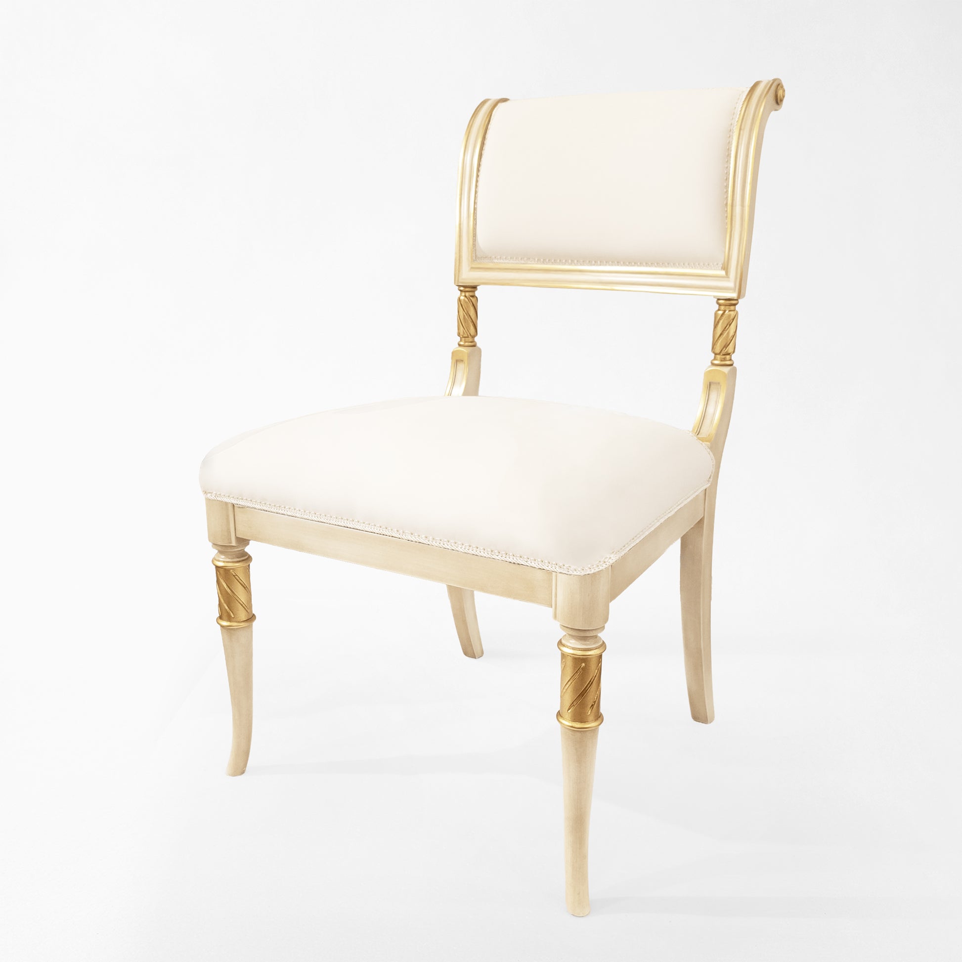 Antique white and gold side chair.