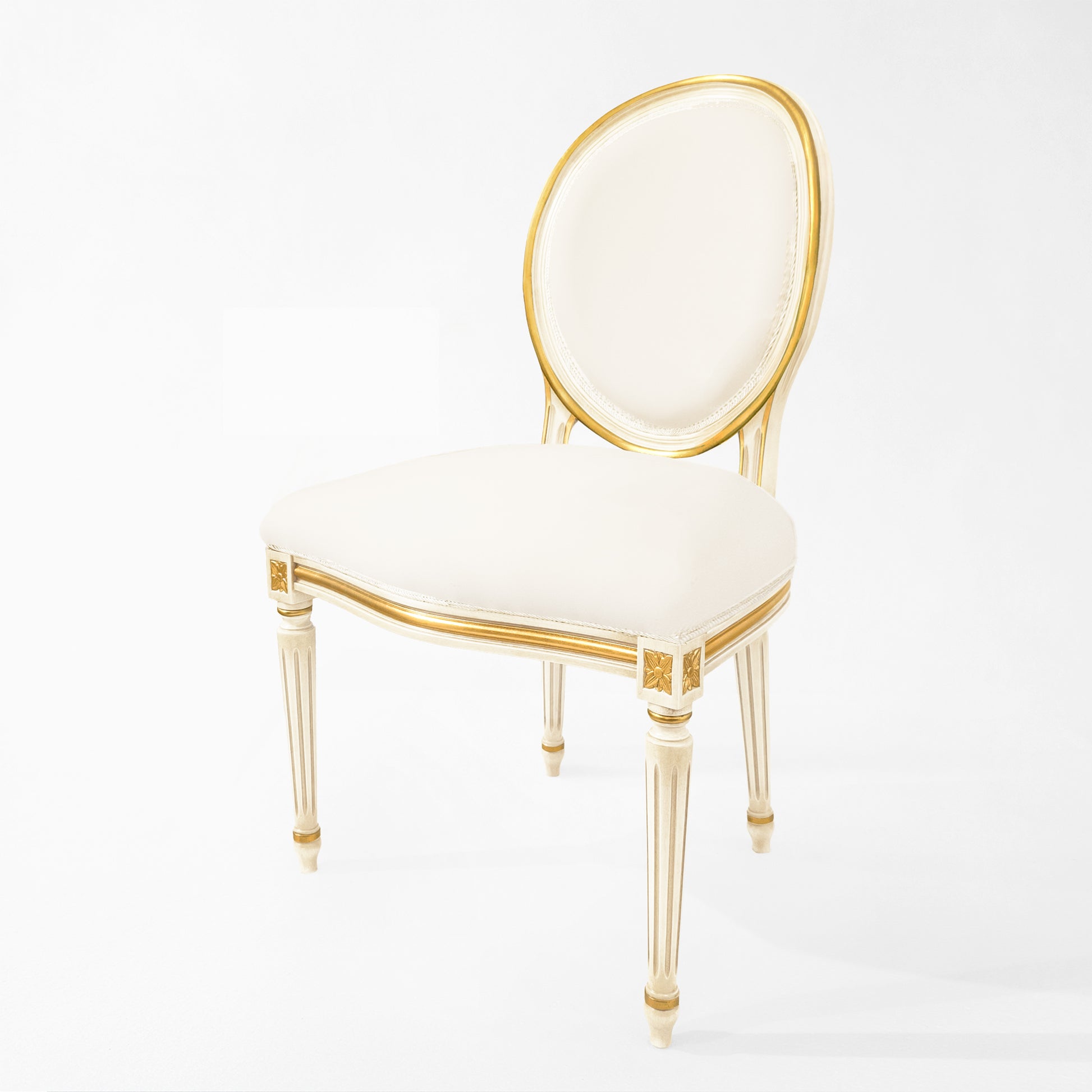 Round white and gold chair with white fabric.