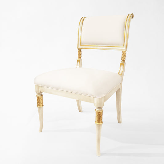 White and gold chair with white fabric.