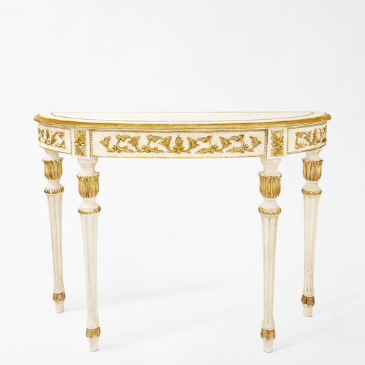 Traditional white console table with ornate gold details.