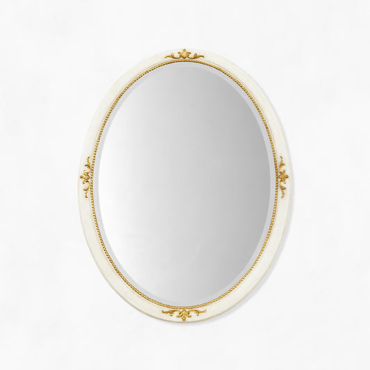 Traditional oval white mirror with gold details.