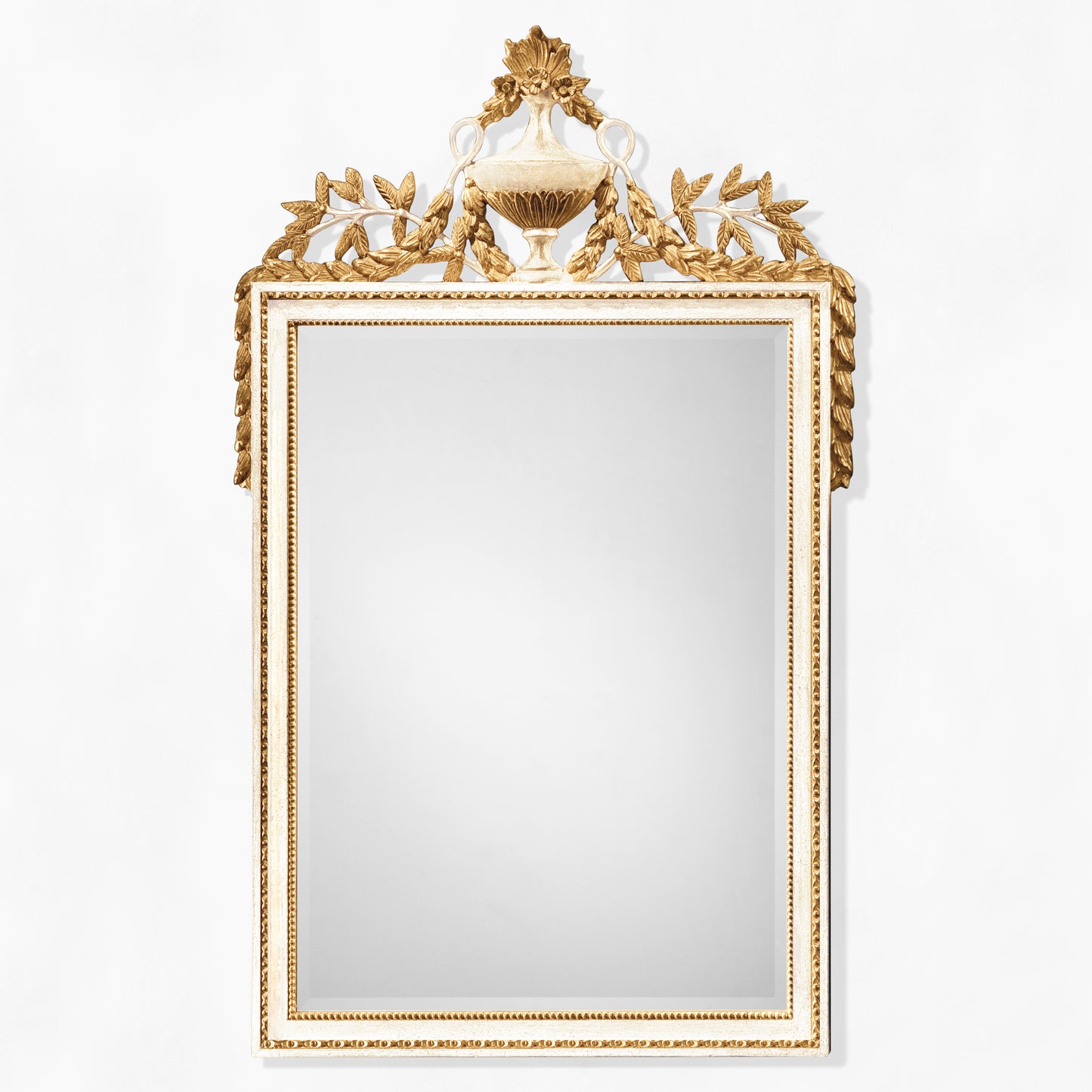 Ornate white mirror with intricate carved gold details.