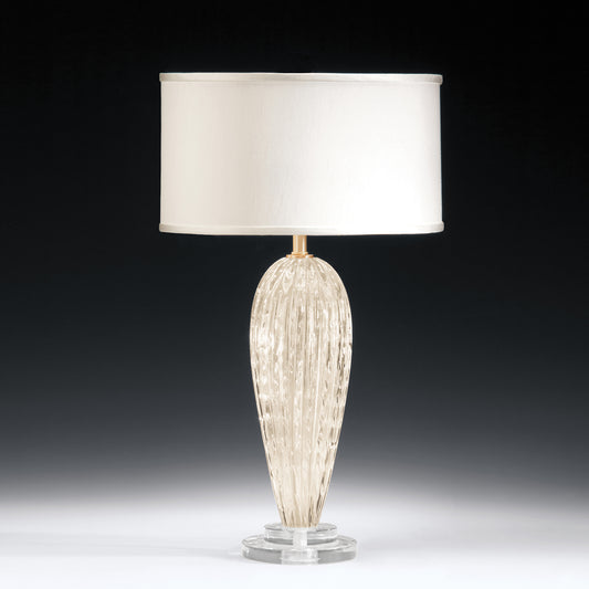 White Venetian glass table lamp with gold accents.
