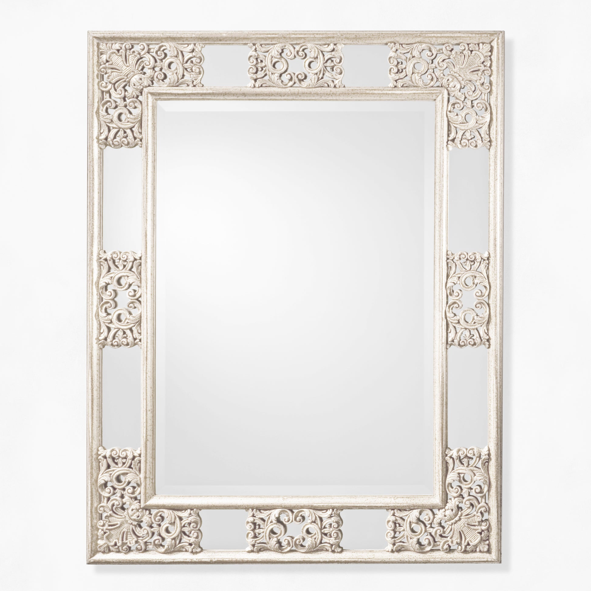 Antique white ornate mirror.