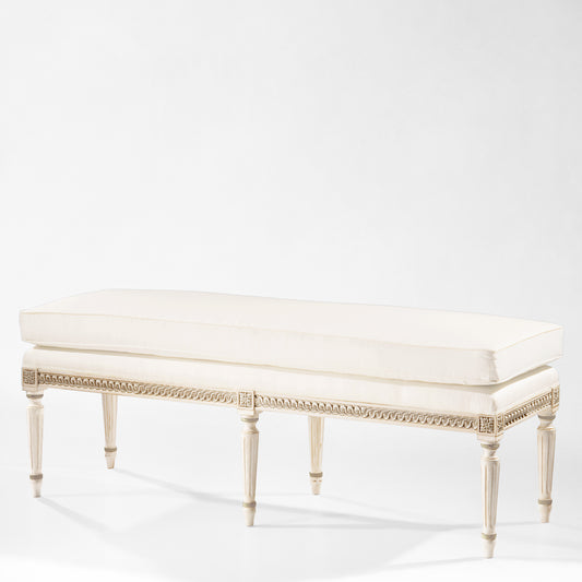 White Italian bench with silver details and cream cushion.