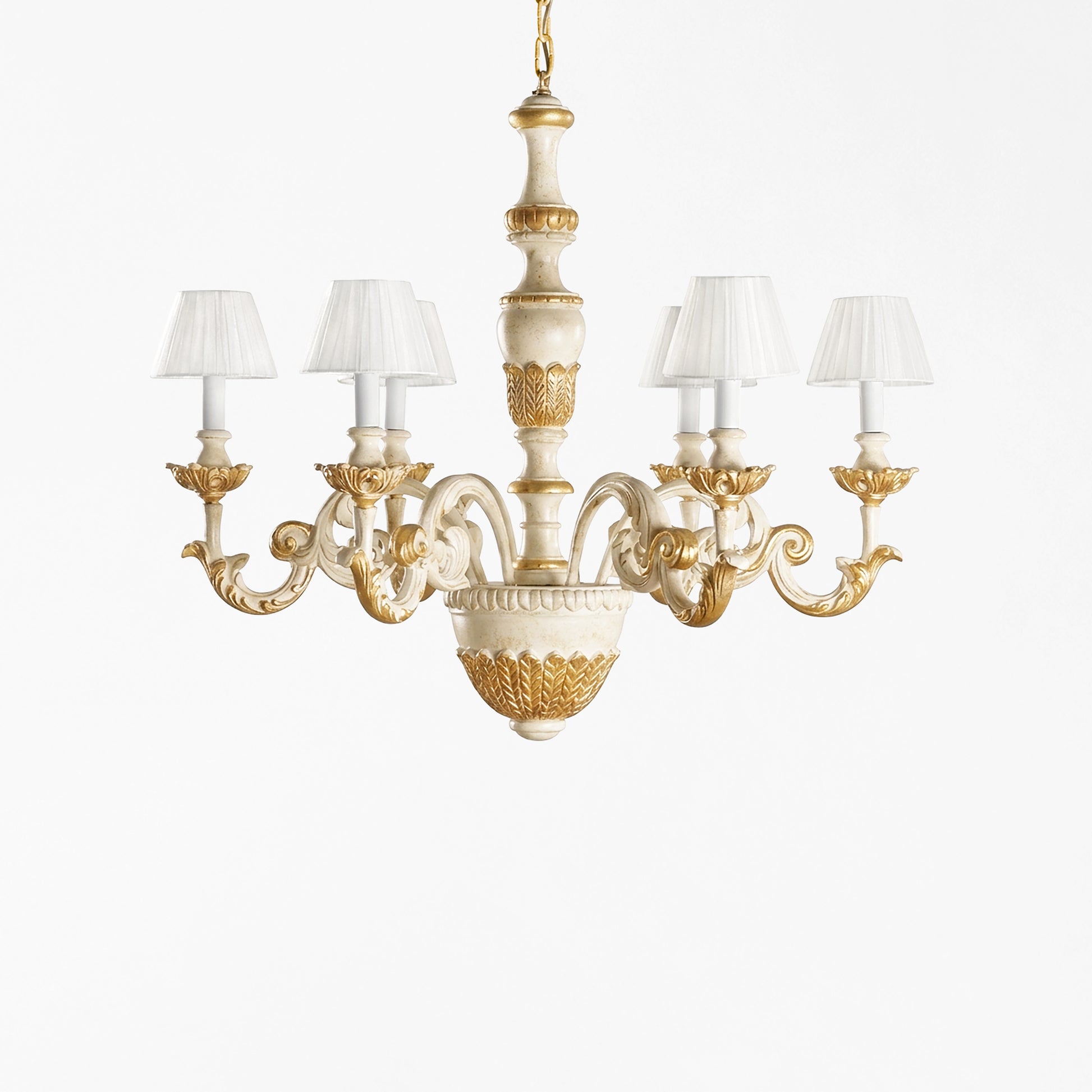 Traditional Italian wood chandelier with white and gold finish and white pleated shades.
