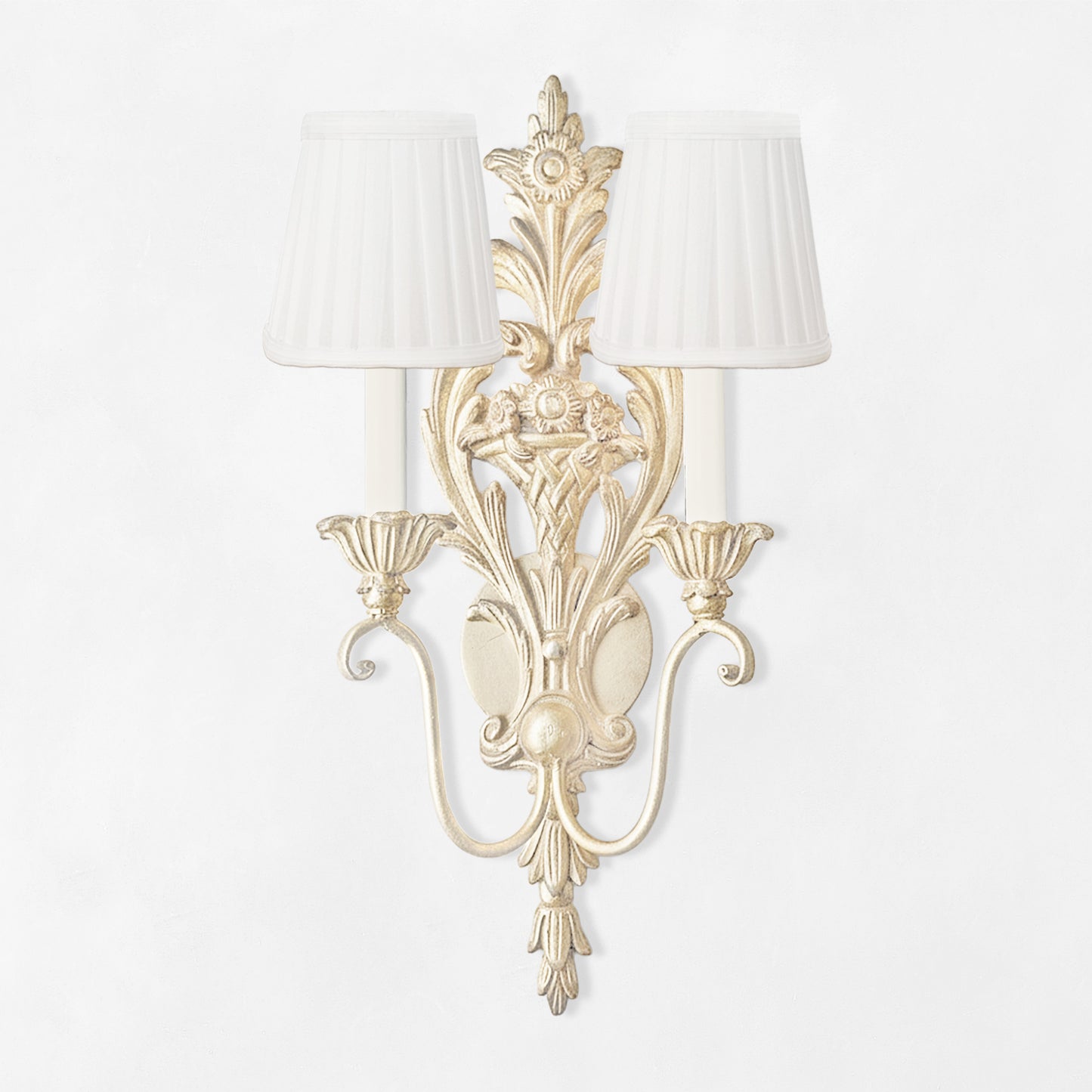 Traditional antique white wood sconce with white pleated shades.